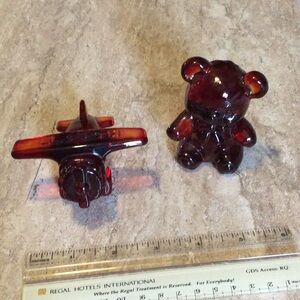 Red glass nicknacks, airplane and teddy bear